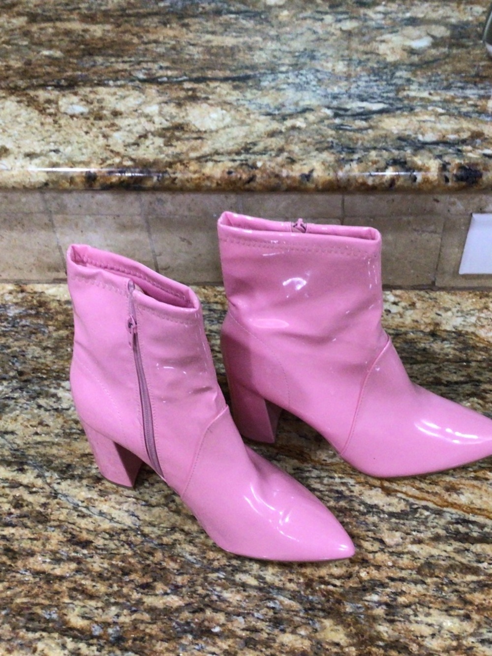 Fun and funky, patten leather looking ankle boots in hot pink size 8 1/2
